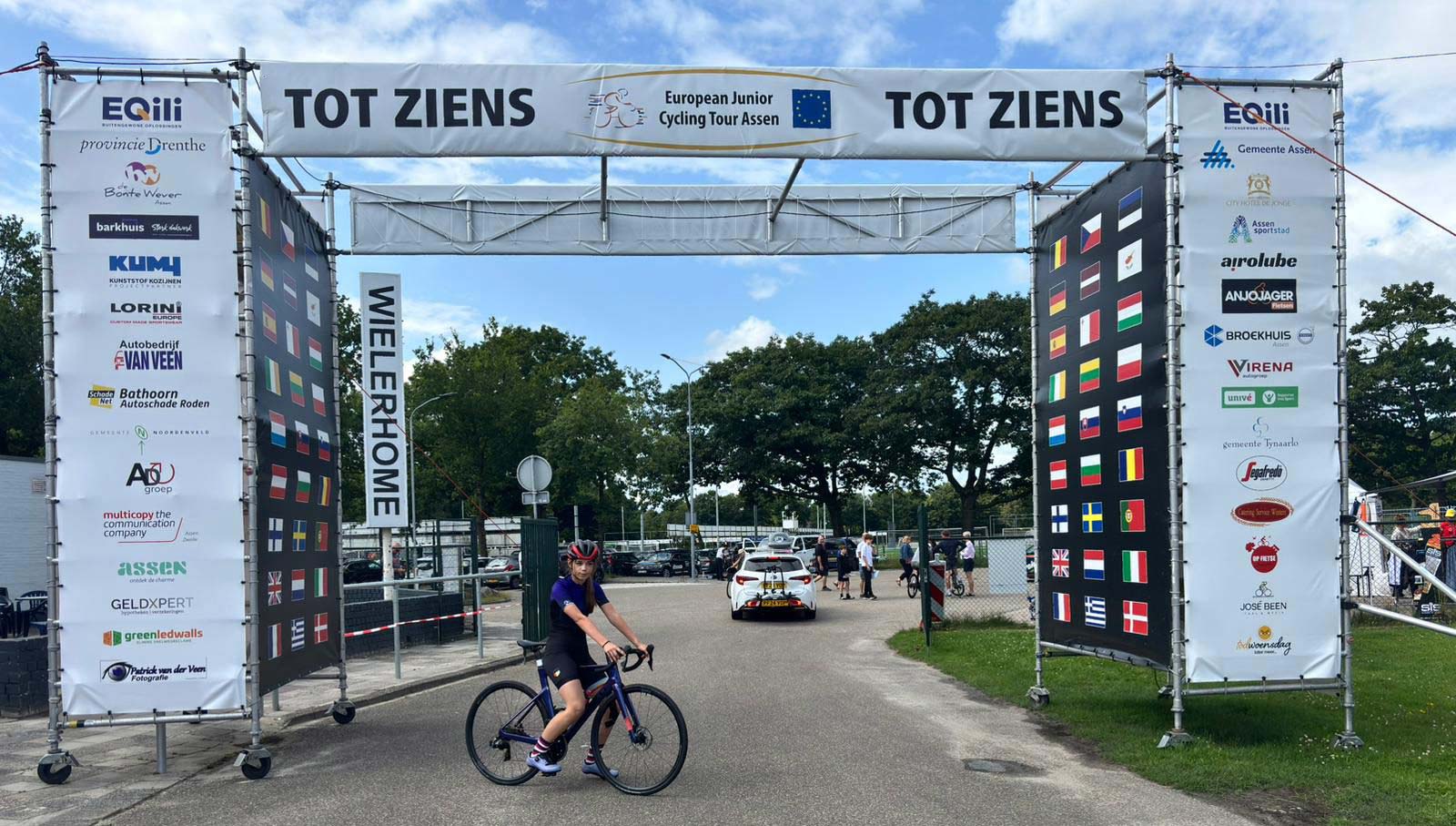 The Tour of Assen finish gantry and somewhere in there is Jorgie!